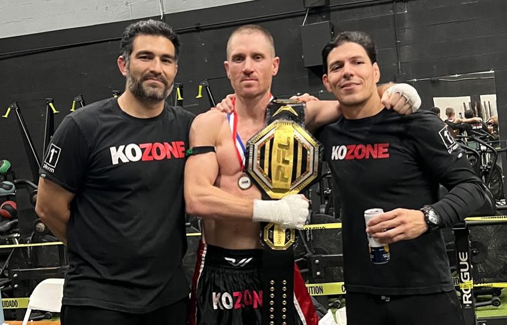 KO Zone PFL champion with belt and coaches